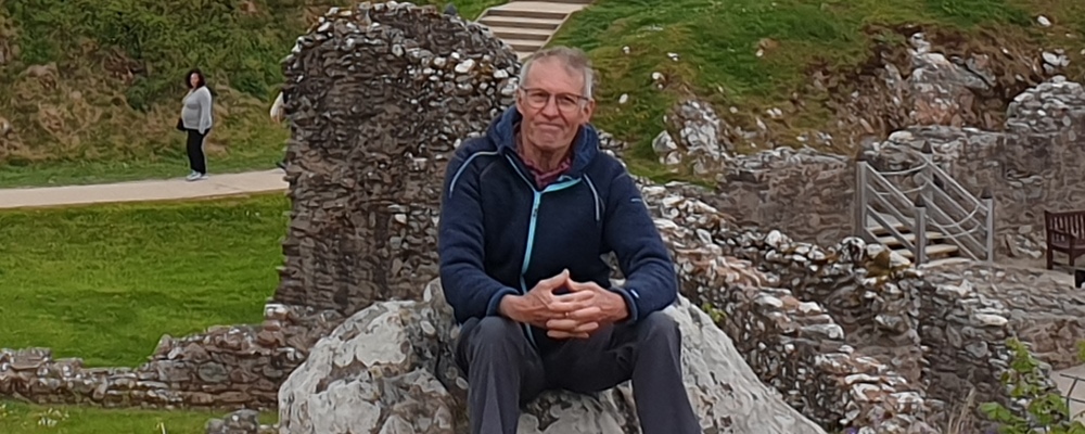 Bikeability volunteer Douglas sitting on a rock